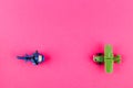 Small plastic airplane and helicopter with copy space on pink background Royalty Free Stock Photo