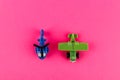 Small plastic airplane and helicopter with copy space on pink background Royalty Free Stock Photo