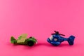 Small plastic airplane and helicopter with copy space on pink background Royalty Free Stock Photo