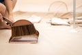 Small plastic broom and dustpan,hands of woman use a portable broom brush sweep the dirt scattered on the floor,hygienic and Royalty Free Stock Photo