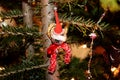 The small plastic figure caught on the christmas tree