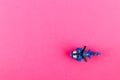 Small plastic helicopter with copy space on pink background Royalty Free Stock Photo