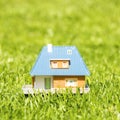 Small plastic house on green grass