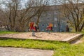 Small playground with sand and two spring play motorcycles