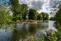 Small pleasure cruise boat on the River Avon in Stratford on a beautiful summer day Royalty Free Stock Photo