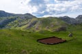 A small plowed field on a farm. Beautiful old mountain village Royalty Free Stock Photo