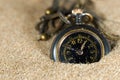 Small Pocket watch in the Sand Royalty Free Stock Photo