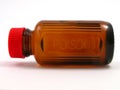 Small poison bottle with red cap Royalty Free Stock Photo