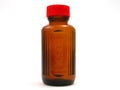 Small poison bottle with red cap Royalty Free Stock Photo