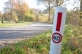 Small pole at the side of the road reminding to max at 60 kph Royalty Free Stock Photo