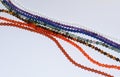 Collection of various mineral beads on thread Royalty Free Stock Photo