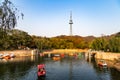 Small pond with boats in Zhongshan Park in Autumn, Qingdao, China