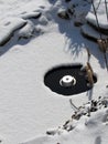 Small pond with an electric heater to melt the ice Royalty Free Stock Photo