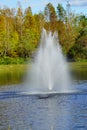 A small pond and geyser in a Florida community Royalty Free Stock Photo