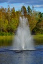 A small pond and geyser in a Florida community Royalty Free Stock Photo