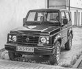 Old small four wheel drive Suzuki Jimny front view parked