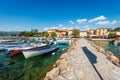 Small port of Lake Garda with moored boats - Village of Cisano Veneto Italy Royalty Free Stock Photo