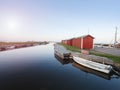 Small port at fishing village with boats. Quiet bay at stony dam. Summer traveling in Sweden. Royalty Free Stock Photo