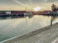 Small port at fishing village with boats. Quiet bay at stony dam. Summer traveling in Sweden. Royalty Free Stock Photo