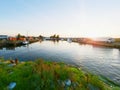Small port at fishing village with boats. Quiet bay at stony dam. Summer traveling in Sweden. Royalty Free Stock Photo
