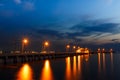 Small port ship and reflect lamp in night time Royalty Free Stock Photo