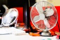 Small, portable switched off fan on desk in office