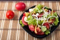 Small portion of vegetable salad of tomato, cucumber, olives Royalty Free Stock Photo