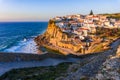 Small Portugal village Azenhas do Mar on cliff on coastline with sunset Royalty Free Stock Photo