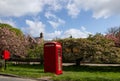 Small Post Box next to a Red Telephone Box. Royalty Free Stock Photo