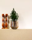 A little fir tree and a hand made wooden candlestick.