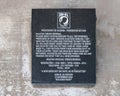 Small POW-MIA memorial with engraved stone featuring Mary, Mother of Vocations, outside Saint Mary Catholic Church in Marfa Royalty Free Stock Photo