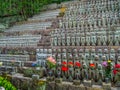 Small praying monk statues at Hase Dera Temple in Kamakura - TOKYO, JAPAN - JUNE 12, 2018