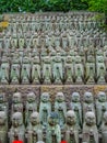 Small praying monk statues at Hase Dera Temple in Kamakura - TOKYO, JAPAN - JUNE 12, 2018