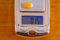 small precision scales with a corn kernel weighing 0.15g on the digital display.