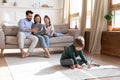 Young family with small kids relax in living room Royalty Free Stock Photo