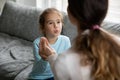 Small disabled girl learn sign language with mom