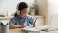 Small girl handwrite studying at home on weekend Royalty Free Stock Photo