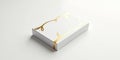 Elegant white box with golden flourish design on a white surface Royalty Free Stock Photo