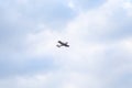 Small private flying airplane yet flying in the sky with cloudy weather