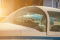 A small private plane with propeller stands at the airport, in bright, sunny day. Royalty Free Stock Photo