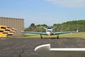 Small prop aircraft at airport on tarmac Royalty Free Stock Photo