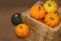 Small pumpkin in crate,woodenbackground