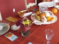 Small pumpkins and gourds of various colors, displayed on platters from various angles and depth Royalty Free Stock Photo