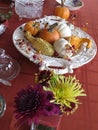 Small pumpkins and gourds of various colors, displayed on platters from various angles and depth Royalty Free Stock Photo