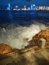 Small Qingdao Park waves and distant city night scenery