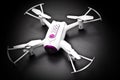 Small Quadrocopter drone robot studio work white Royalty Free Stock Photo