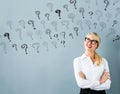 Small question marks with young woman Royalty Free Stock Photo