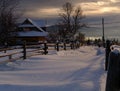 Small and quiet alpine village and winter sunrise snowy mountains around, Voronenko, Carpathian, Ukraine Royalty Free Stock Photo