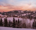 Small and quiet alpine village and winter sunrise snowy mountains around, Voronenko, Carpathian, Ukraine