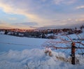 Small and quiet alpine village and winter sunrise snowy mountains around, Voronenko, Carpathian, Ukraine Royalty Free Stock Photo